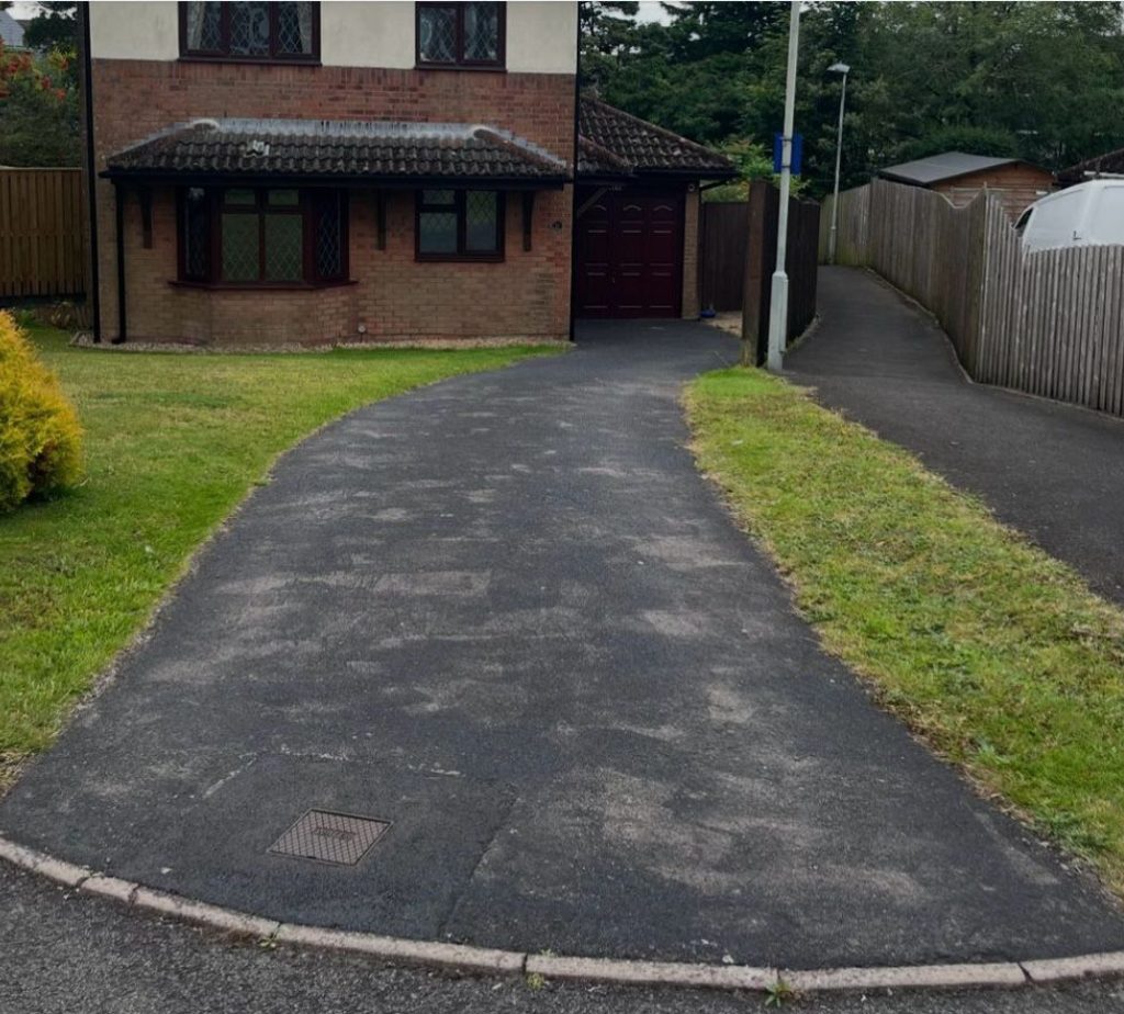 A before photo of an old concrete driveway